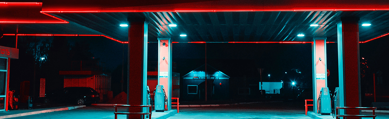 Filling station forecourt lit up at night