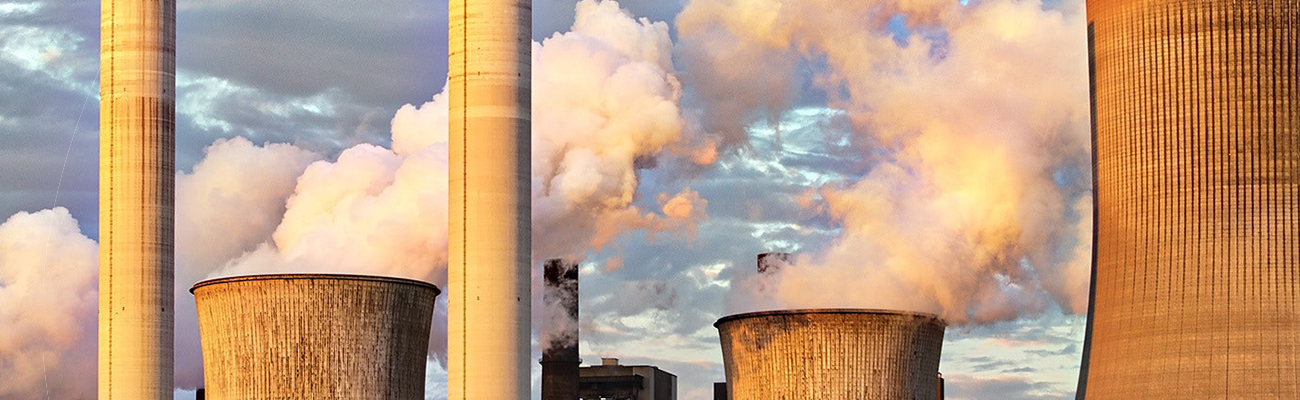 Steam billowing from power plant cooling towers