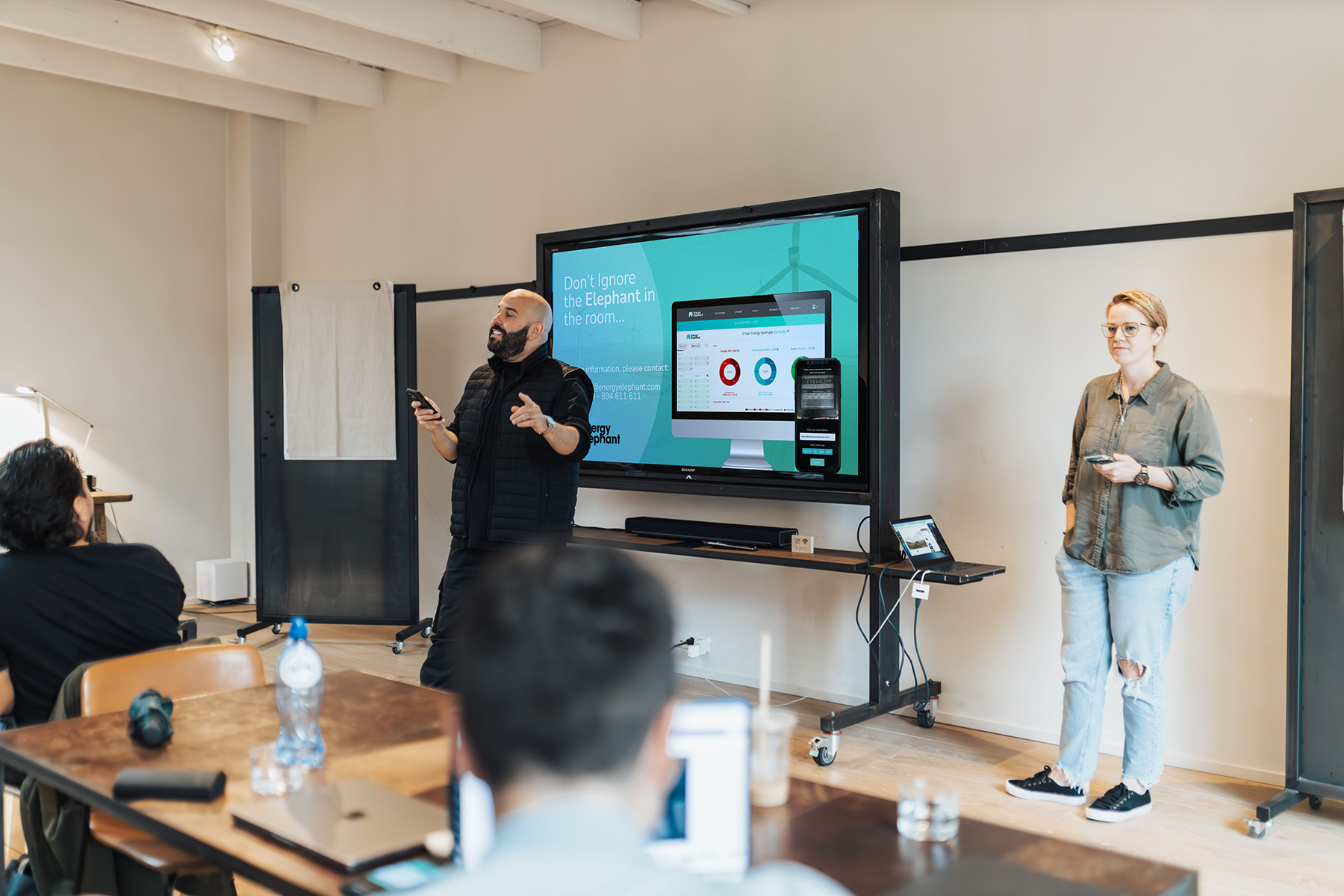 A sustainability team presenting the EnergyElephant software solution to their company's budget setters