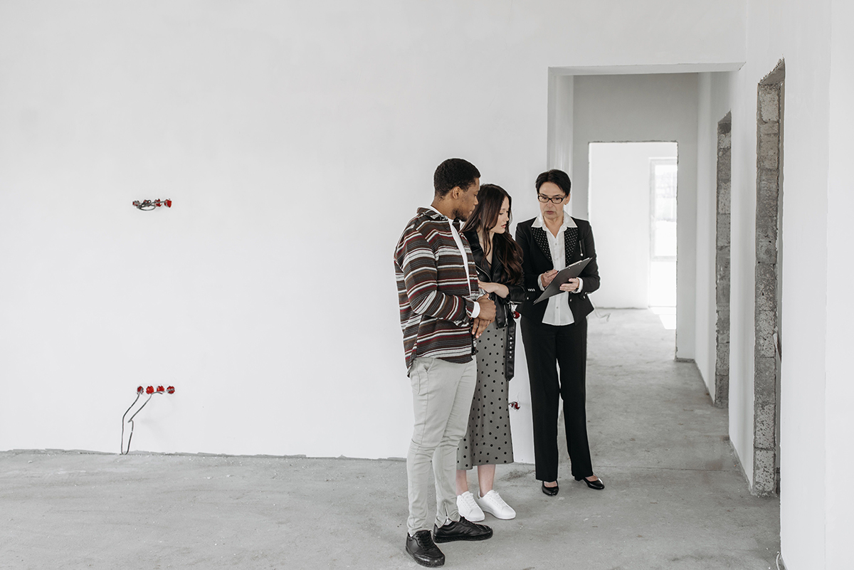 Tenants discussing details of new property with landlord